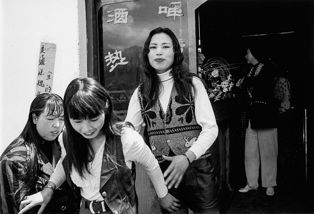 Chinese prostitutes outside a bar in Lhasa